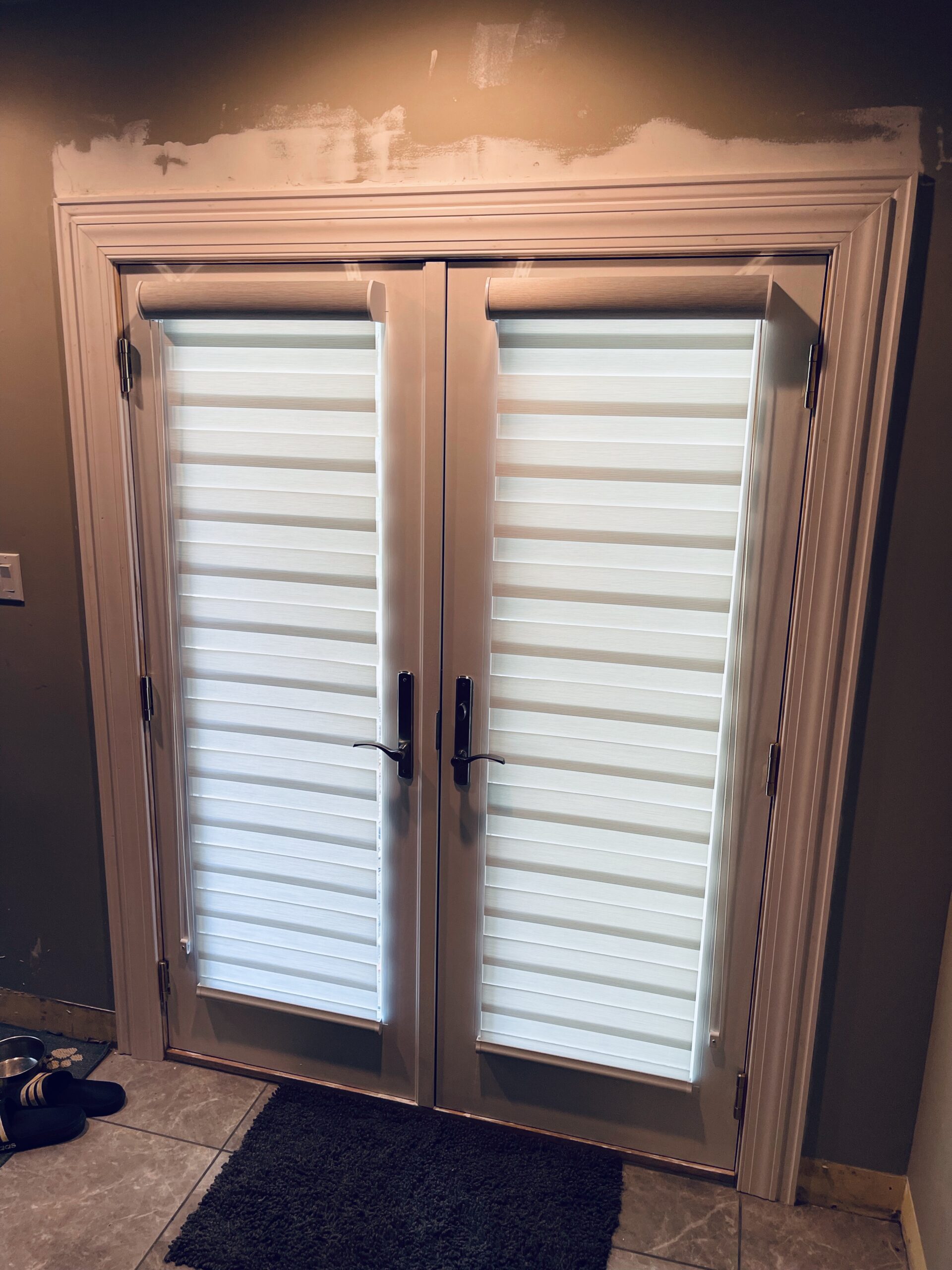 layered shades zebra shades on door
